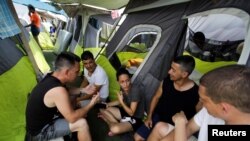 Migrantes cubanos en el refugio Senda de Vida, en Reynosa, Mexico, en mayo de 2022. (REUTERS/Daniel Becerril)