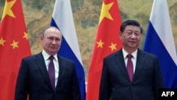 Presidente de Rusia Vladimir Putin (izquierda) y presidente de China Xi Jinping (derecha)