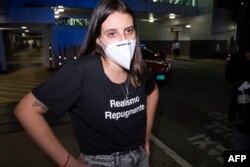 Karla Pérez González se vio forzada a retornar a Costa Rica, donde pidió refugio a las autoridades. (Ezequiel BECERRA / AFP)