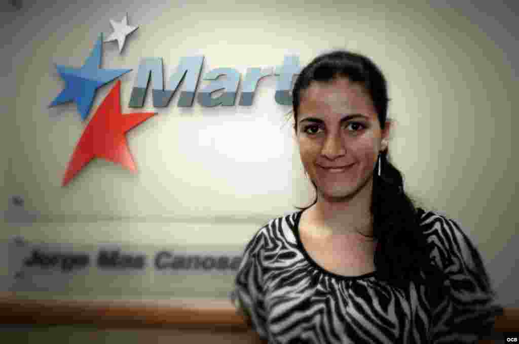 Rosa María Payá stands in front the Martí sign at OCB