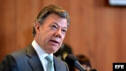 BOG01. BOGOTÁ (COLOMBIA), 25/07/2013.-Fotografía cedida por Presidencia de Colombia del mandatario Juan Manuel Santos hablando hoy, jueves 25 de julio de 2013, en la Corte Constitucional, en Bogotá (Colombia), donde por primera vez en la historia del país