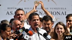 Venezuela's National Assembly president Juan Guaido speaks before a crowd of opposition supporters